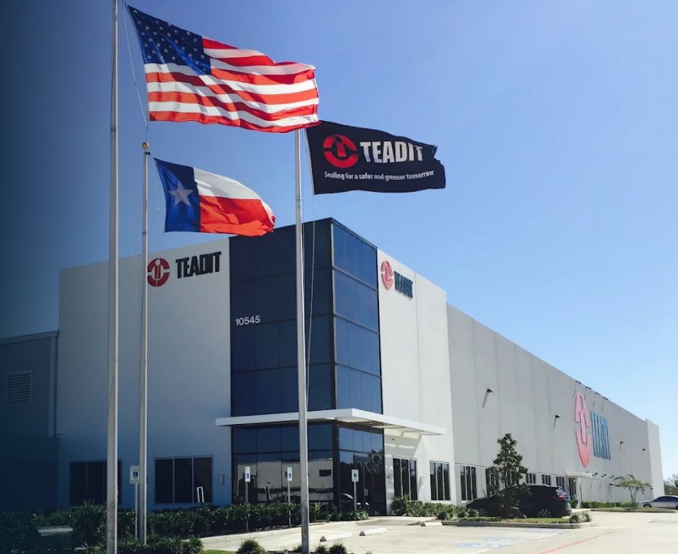 TEADIT North America facility in Pasadena, Texas, with American, Texas and TEADIT flags flying out front.